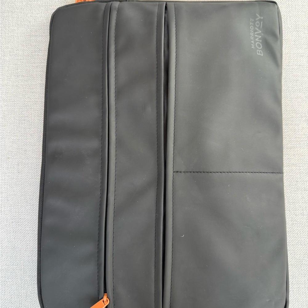 Black and Orange Laptop Bag with Structured Design and Durable Material